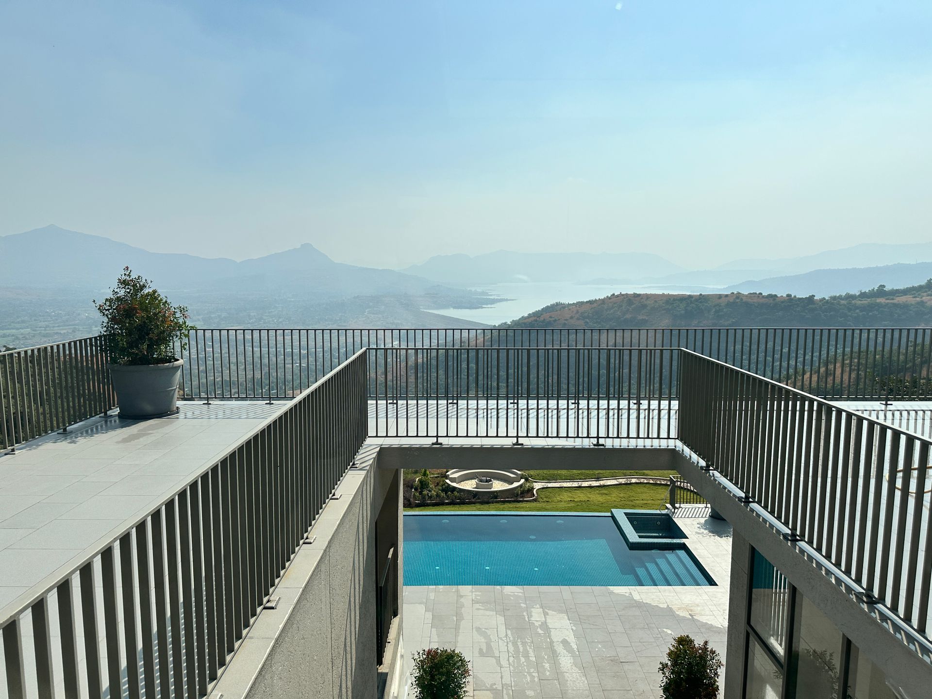 Rooftop pool and terrace looking out over hills